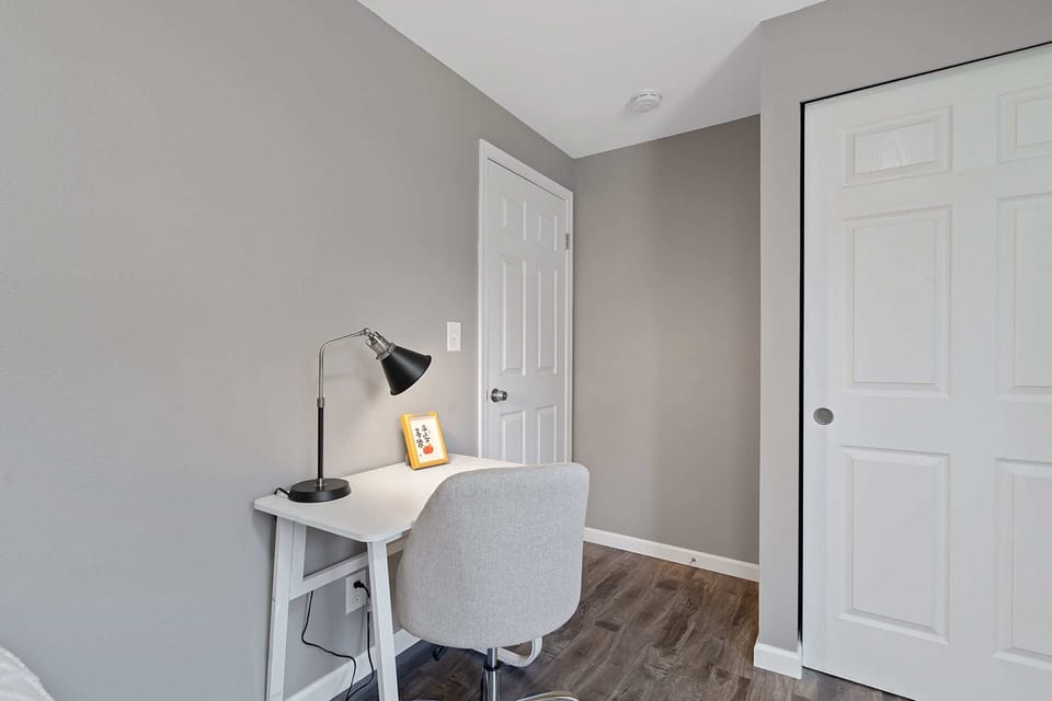 Quiet corner with a comfortable chair and desk, perfect for catching up on work or planning your next adventure.