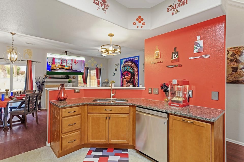 Spacious and well-equipped kitchen with modern appliances and plenty of counter space. Perfect for cooking up a feast or enjoying a quick meal.