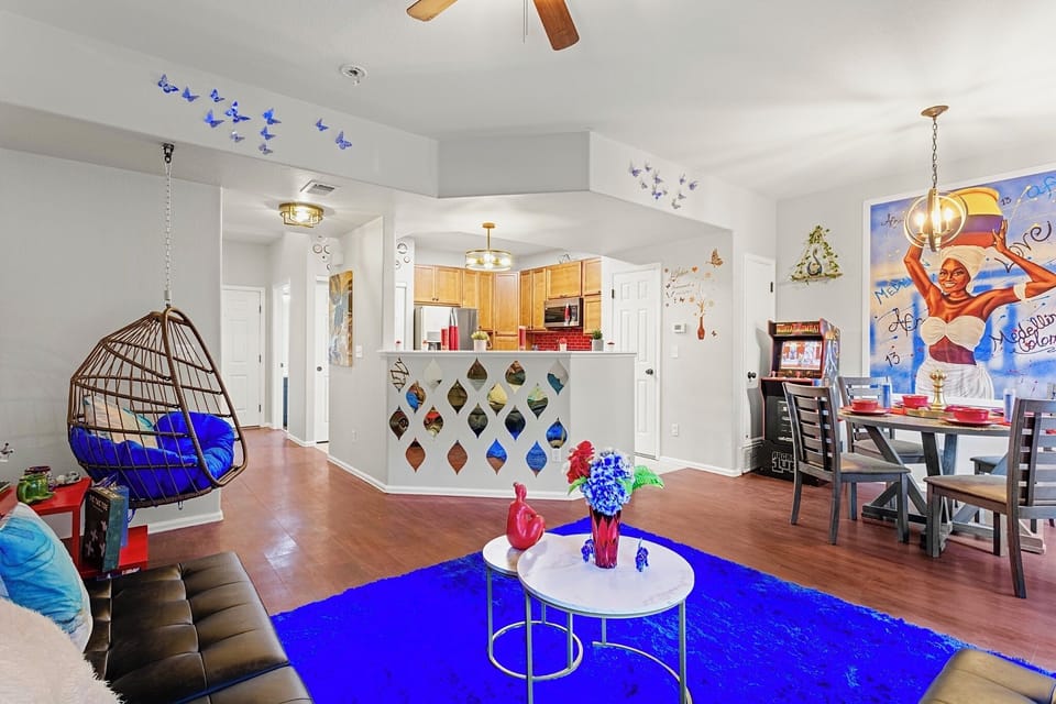 Spacious and open-concept living area with a cozy sitting nook and a fully equipped kitchen. Perfect for entertaining guests or enjoying a quiet night in.