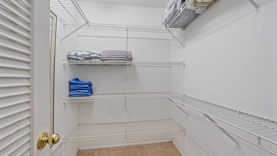 Benefit from the convenience of this spacious linen and storage closet, offering plenty of shelf space for towels, toiletries, and all your vacation essentials.