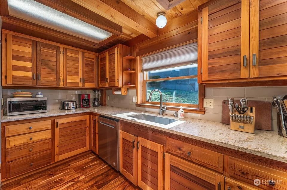 Full kitchen with dishwasher, microwave, fridge, drip coffee maker