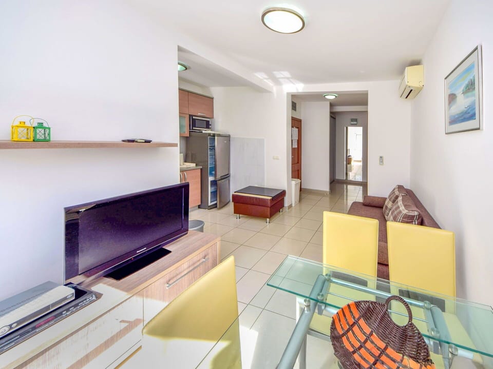 Property, Couch, Picture Frame, Table, Interior Design, Studio Couch, Television, Living Room, Floor, Flooring