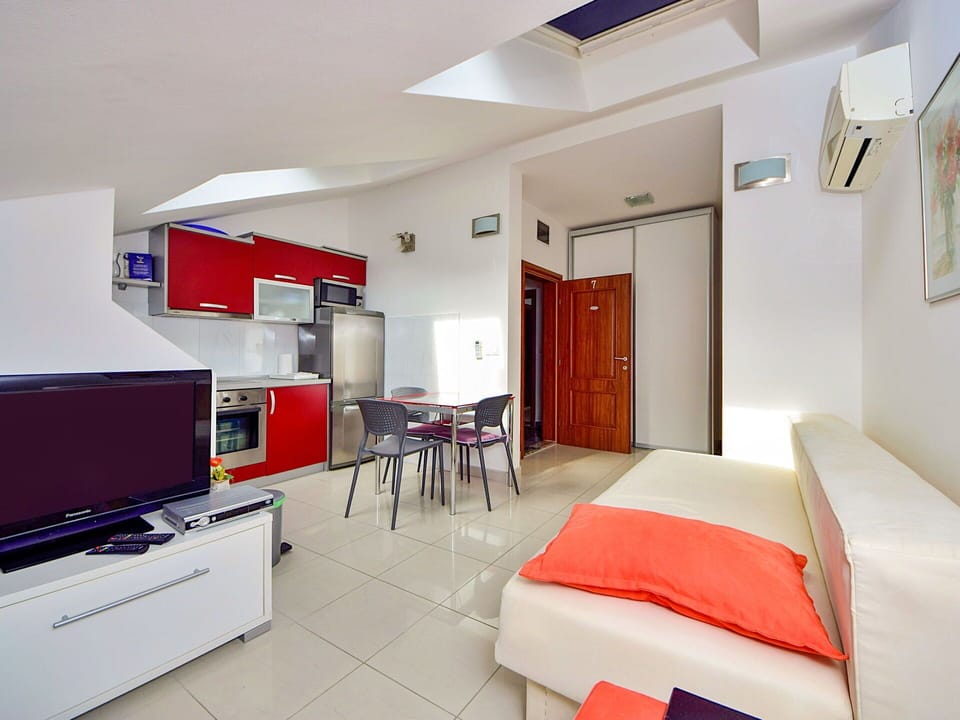Furniture, Property, Comfort, Orange, Building, Interior Design, Television, House, Flooring, Floor