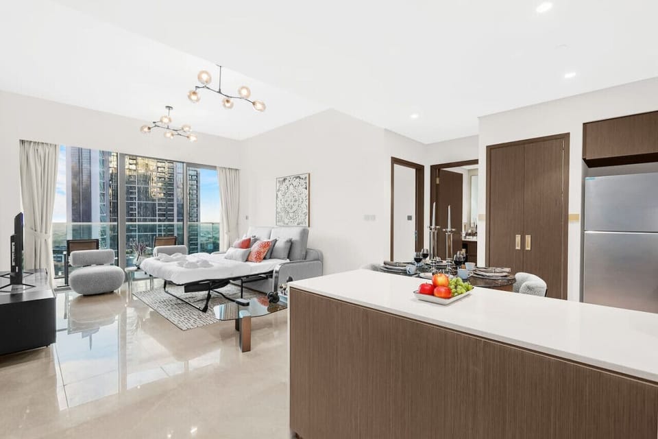Living Room: Elevate your stay with chic decor and stunning city views from the balcony!