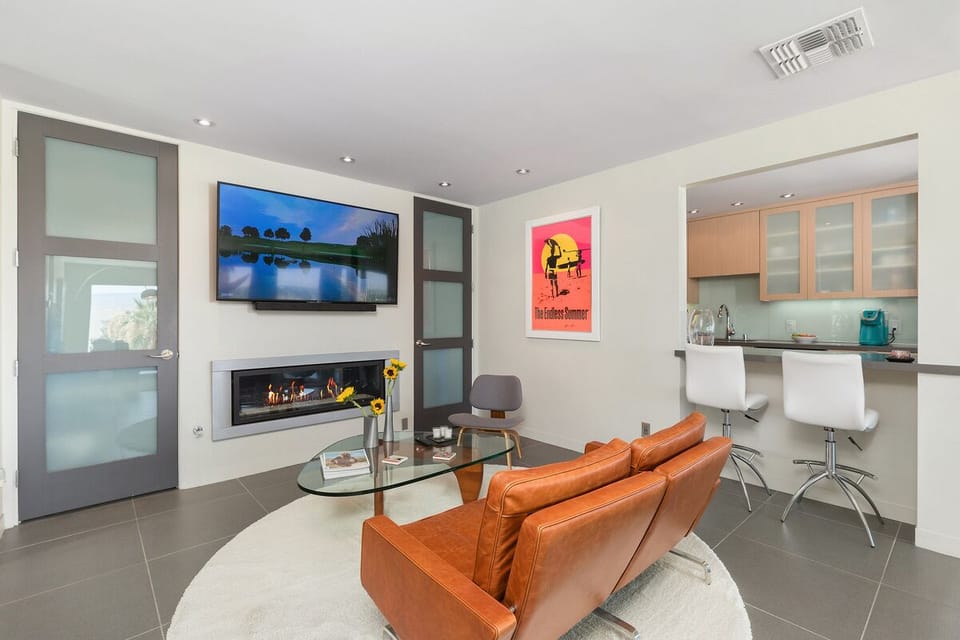 Den with Fireplace and 65" Flatscreen TV