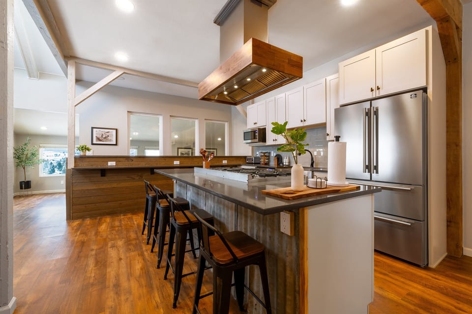 There is plenty of seating at the island and bar to have everyone together while entertaining