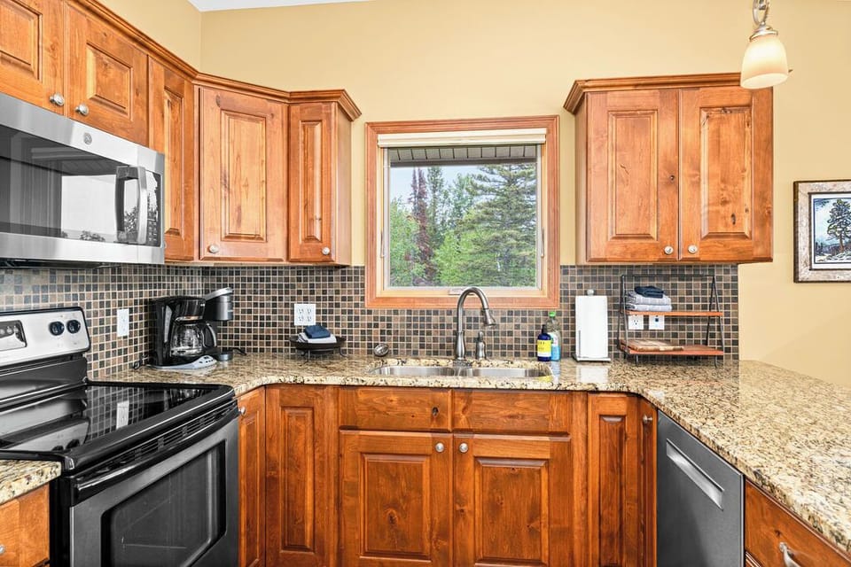 Well stocked kitchen with ample space. New dishwasher and microwave.