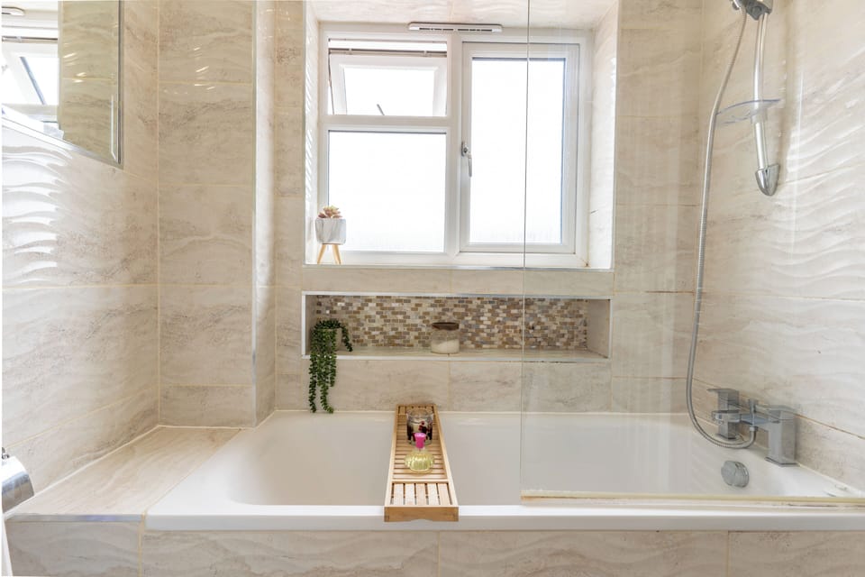 Full bathroom with bathtub.