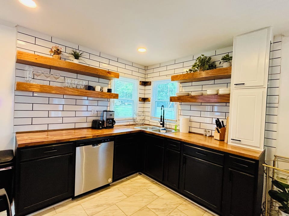 Open kitchen w/coffee maker & plenty of cooking supplies for staying in