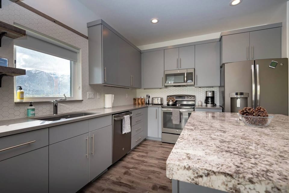 Cook your favorite meals in a kitchen bathed in natural light that enhance the culinary experience.