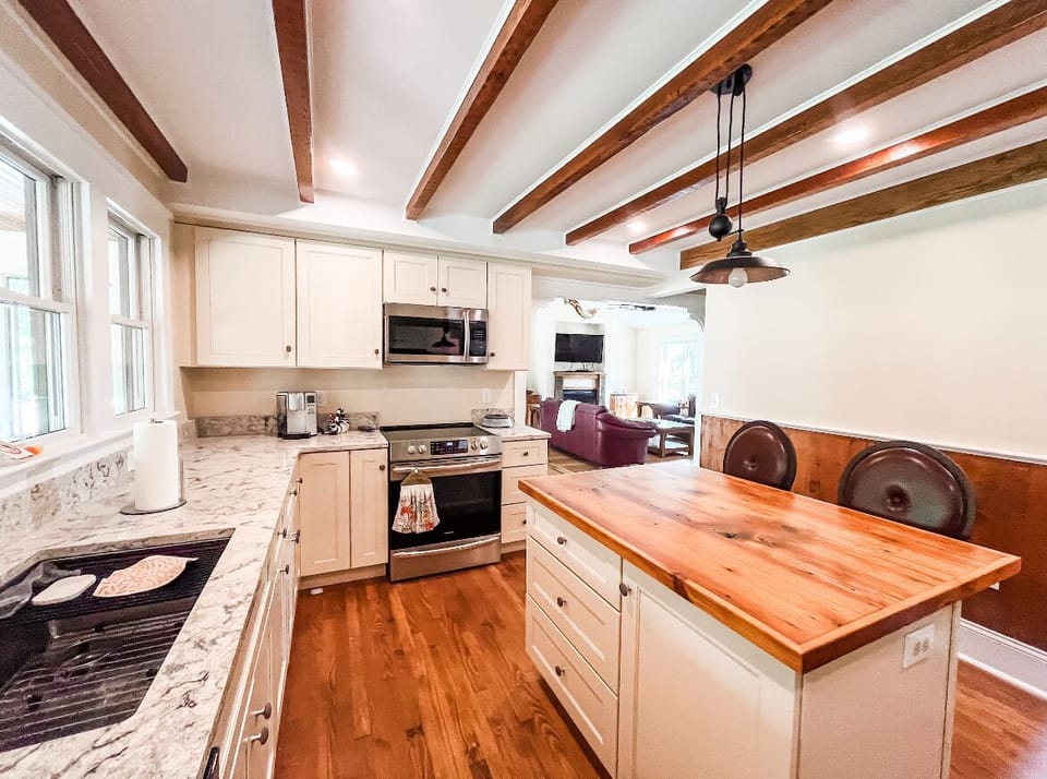 Kitchen with view into living and dining space