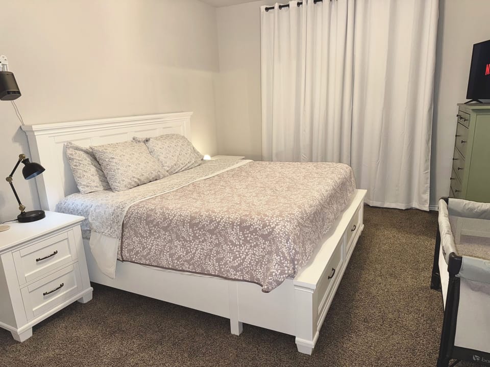 King Bed, pack and play for children, tv and a projector for movie night.