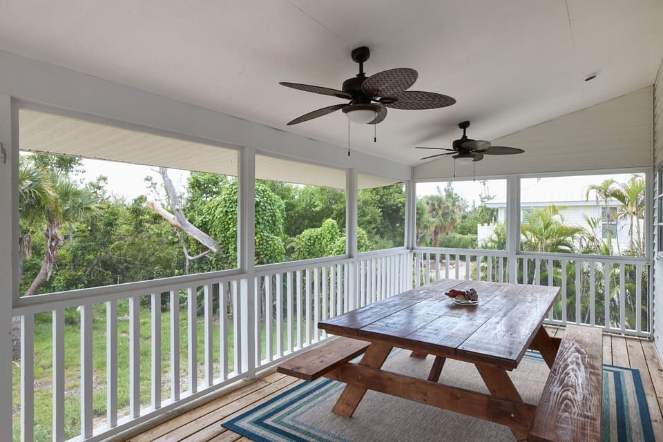 Enclosed portion of patio with dining table