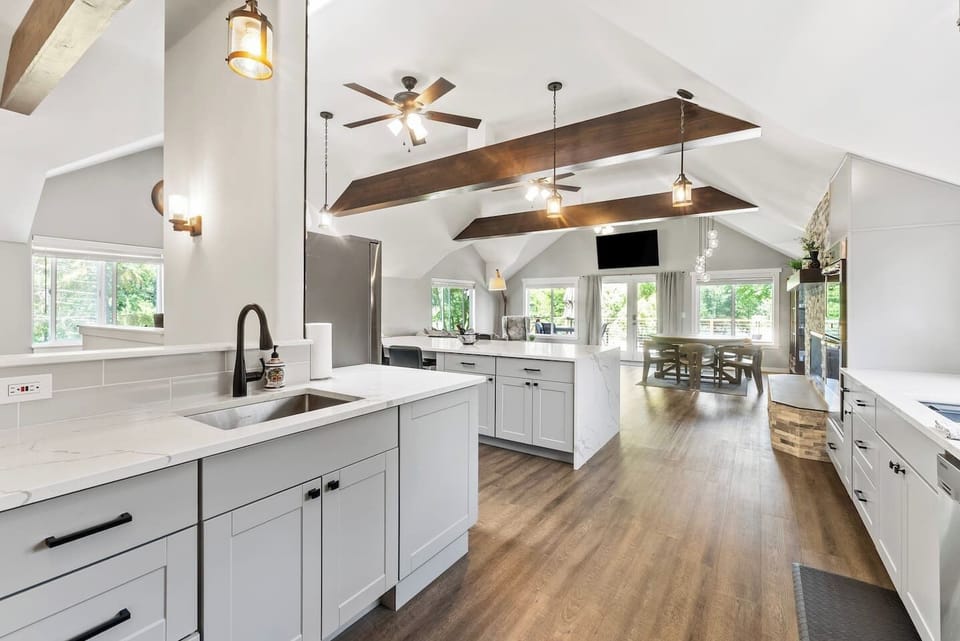 Upstairs Kitchen: Close connection with folks in the living area, and easy to keep an eye on the TV while cooking!