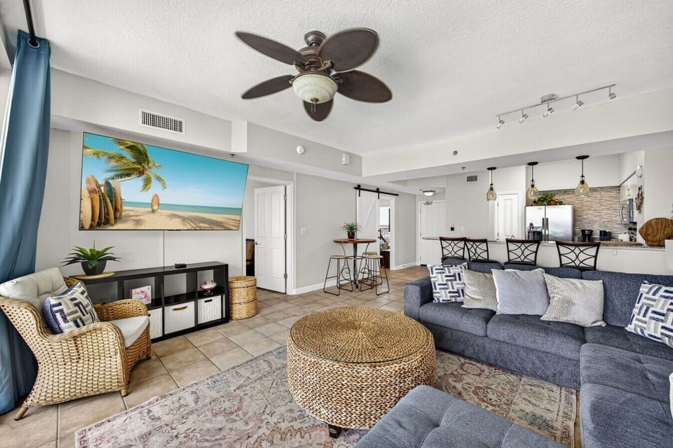 Gather around the oversized sectional after a beach day and enjoy the bright coastal atmosphere.
