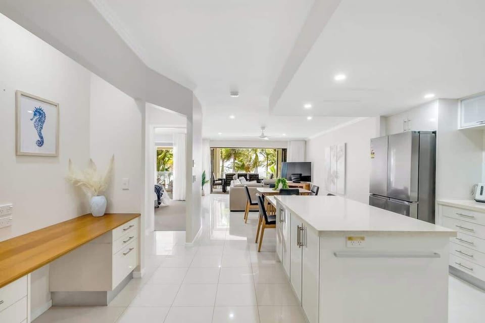 The kitchen is designed around a central island and comes fully equipped for your holiday catering.
