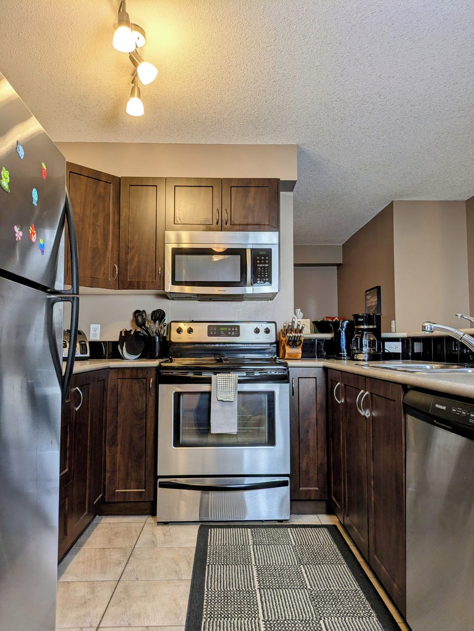 Well equipped kitchen with stainless appliances
