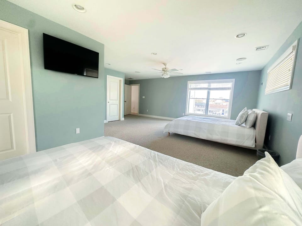 Spacious bedroom with big screen TV! ️✨