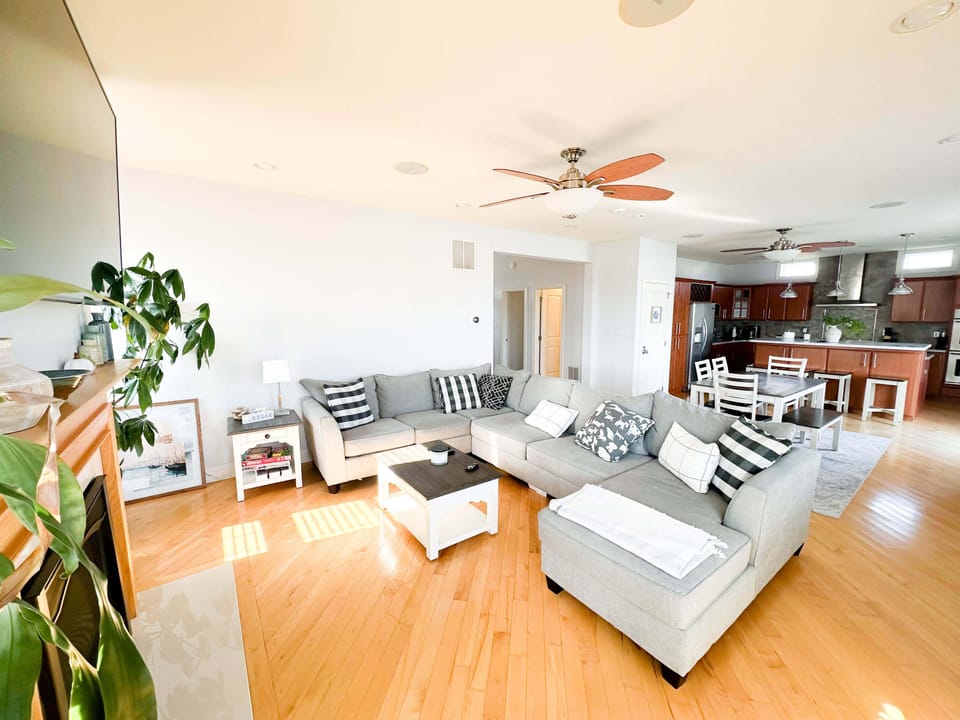 Spacious open-concept living room with cozy sofa bed! ️✨
