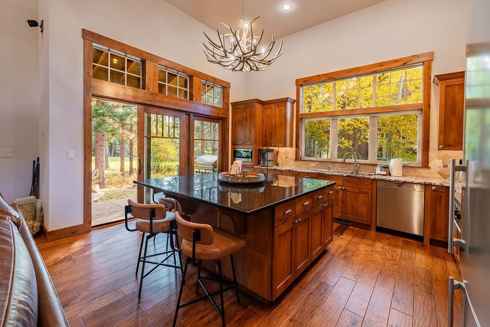 Fully stocked kitchen with oversized island with swivel seating for 5. 