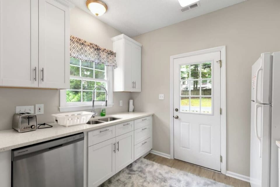 With modern appliances, ample counter space, and large window.