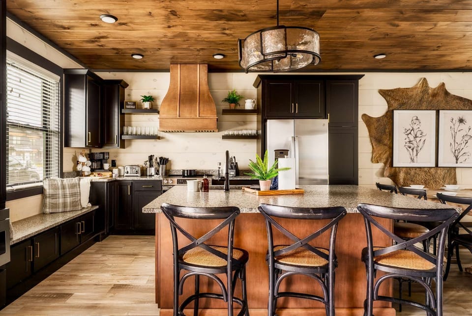 functional kitchenette with a microwave, mini fridge, and stylish decor
