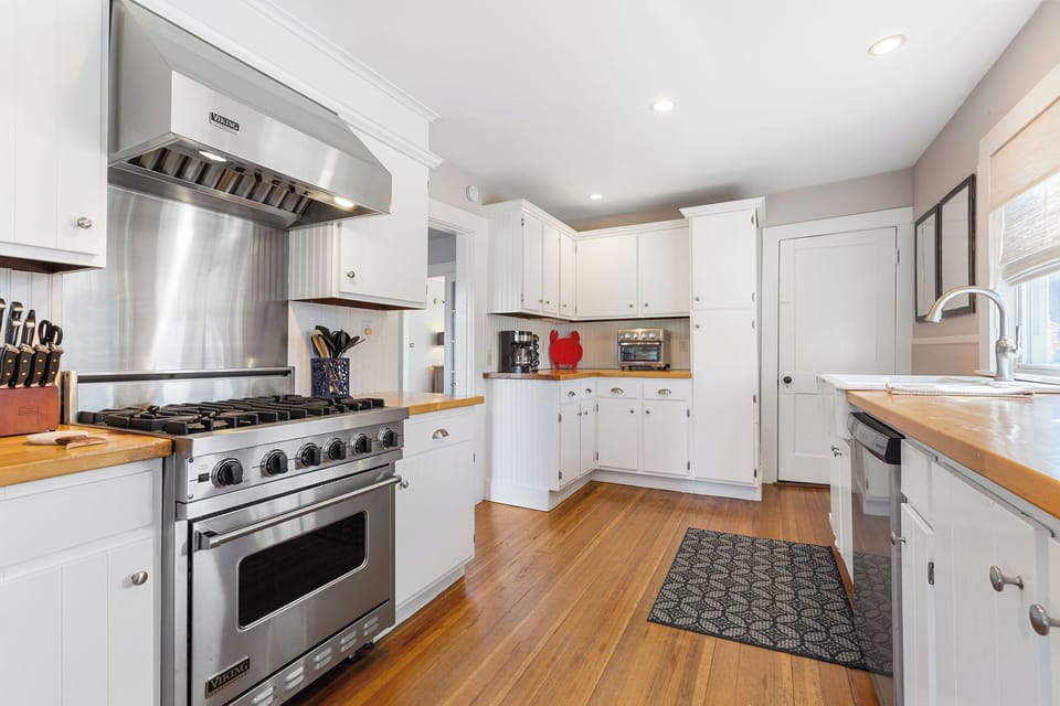 Fully stocked kitchen with modern amenities in this classic Cape Cod home. 