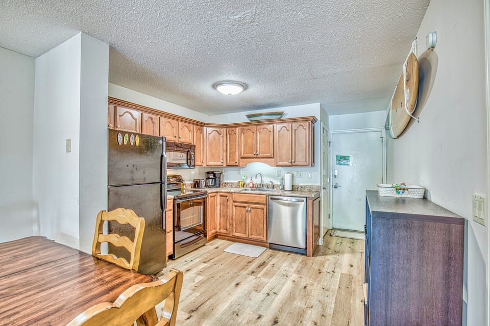 Open layout kitchen and breakfast nook; complete with customized lvp flooring and stainless-steel appliances