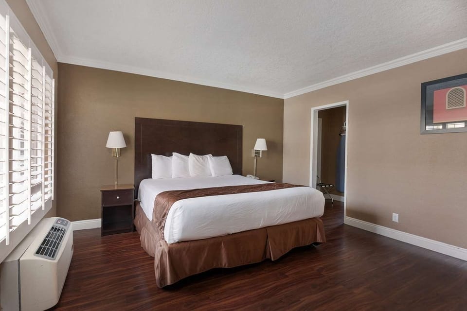 Wake up refreshed beside bright shutters and bedside lighting.