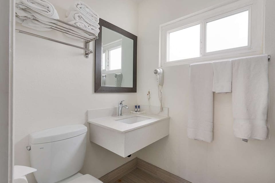 Freshen up easily with clean vanity space and fluffy towels.