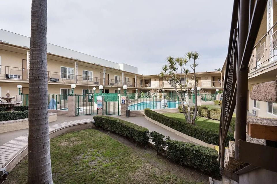 Unwind beside the sparkling pool in a sunny courtyard.