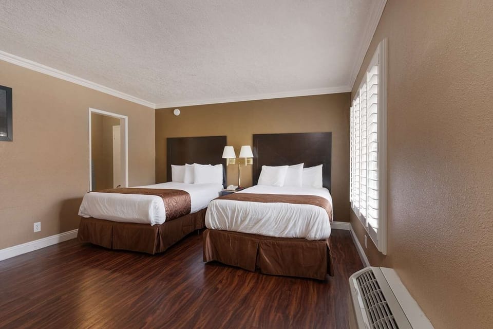 Stretch out and sleep soundly beside bright shuttered windows.