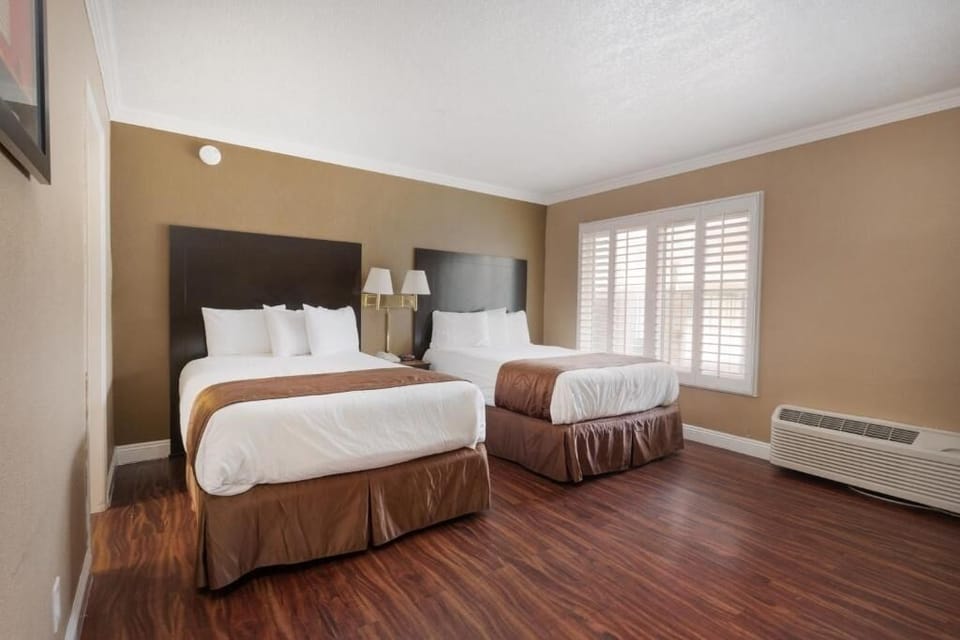 Unwind in a spacious room with two plush beds.
