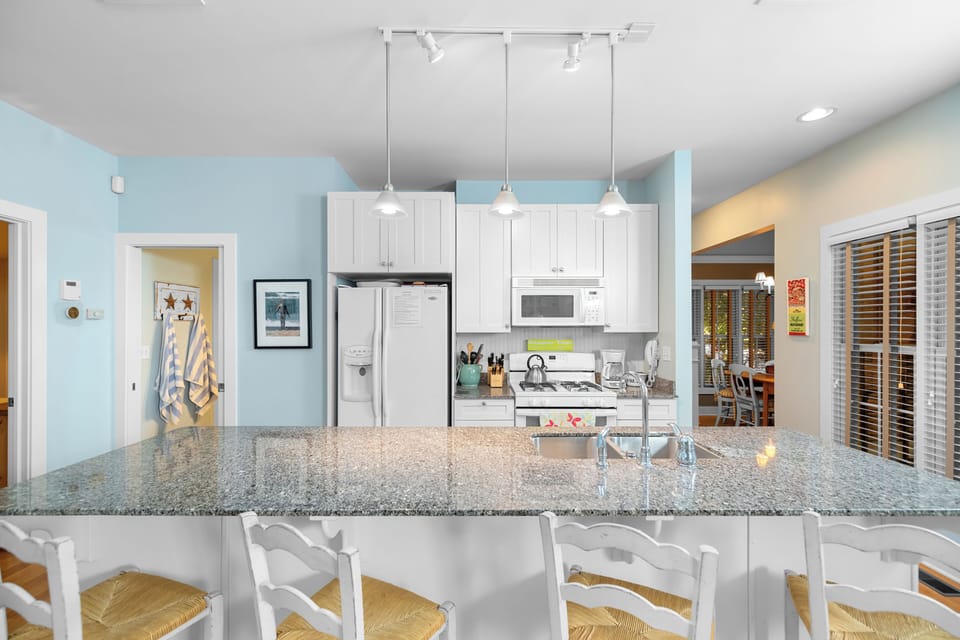 Fully equipped kitchen with seating at the bar