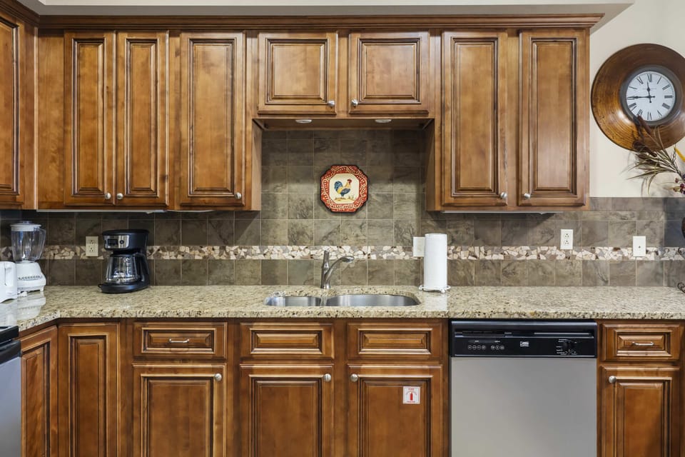 The open kitchen offers ample space & every home comfort