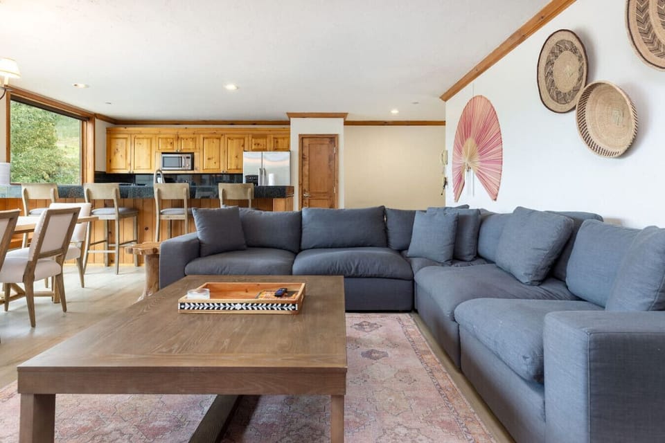 A spacious and bright living room with westward valley views. Gas fireplace and smart TV.
