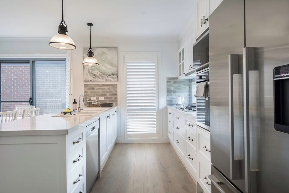 The Hamptons-style kitchen is elegantly appointed with everything you need to prepare meals at home, plus a dishwasher for easy clean-up.