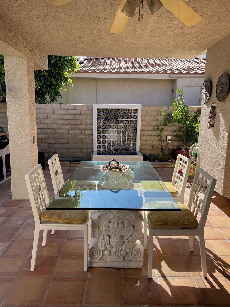 Side patio with built-in BBQ with  access to kitchen and den