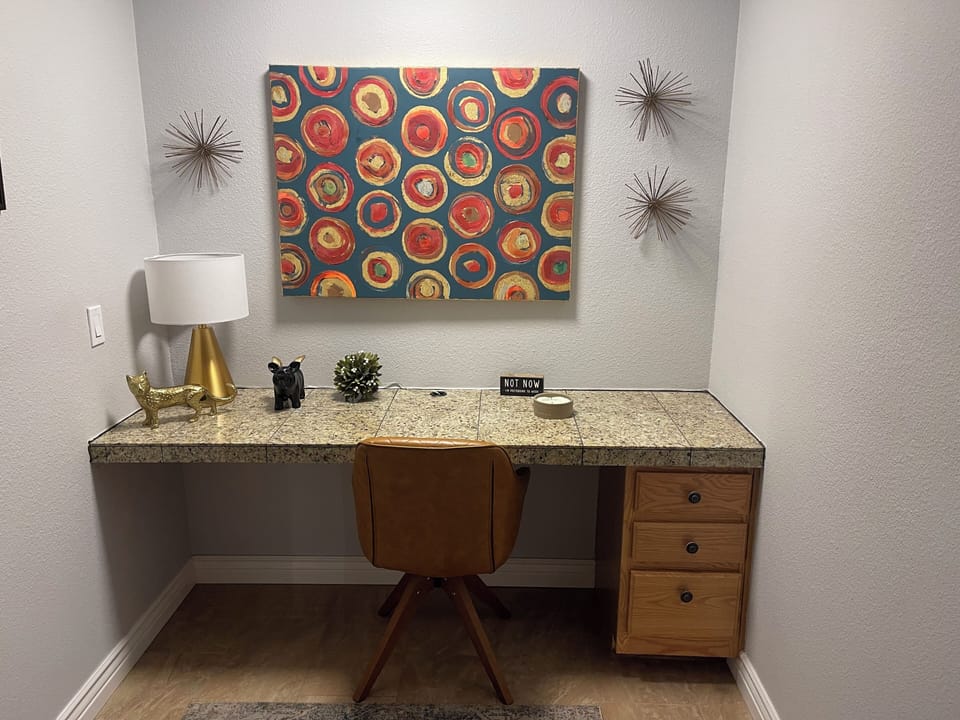 Den with desk and wifi