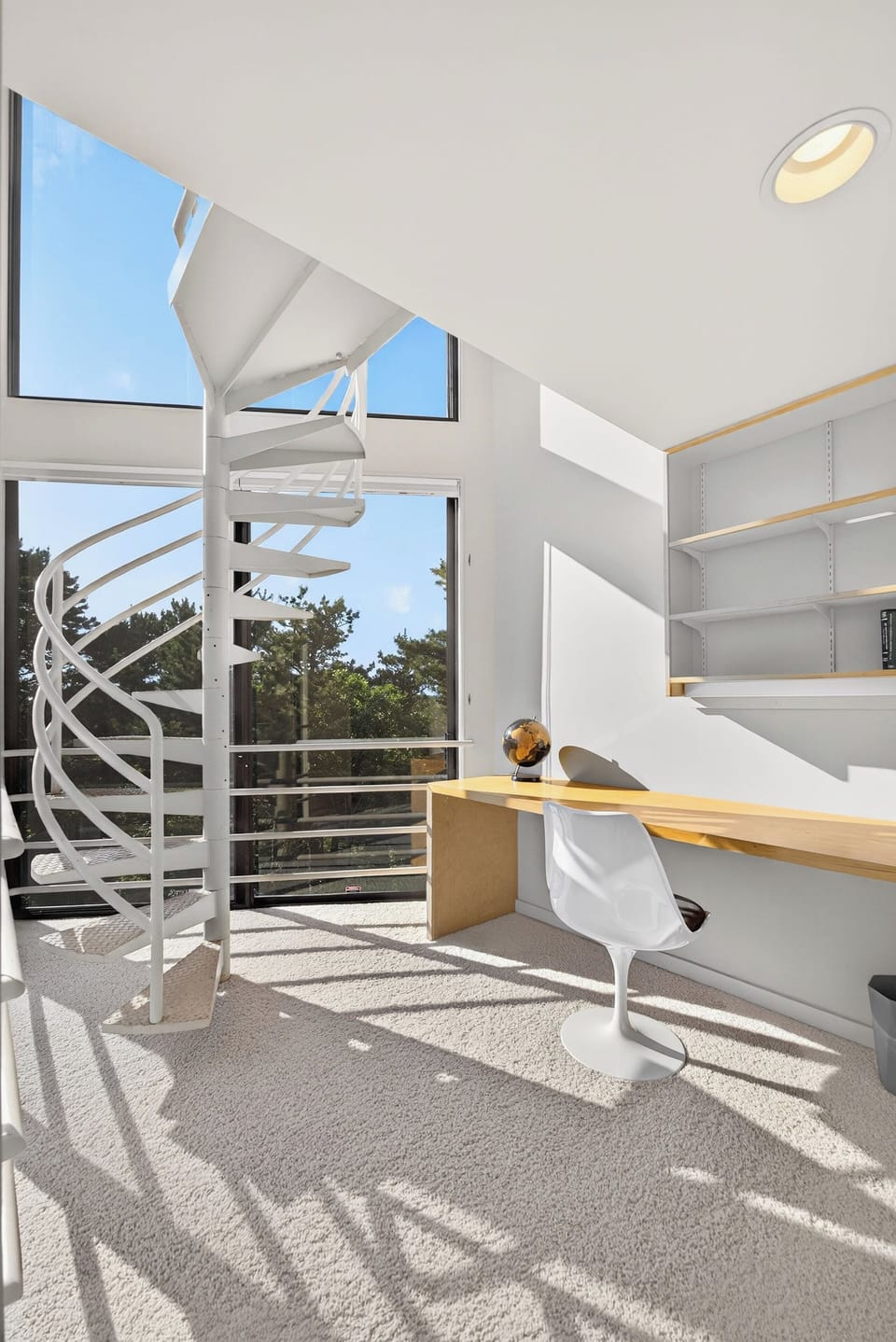 ... framed with a stunning spiral staircase and two levels of glass!