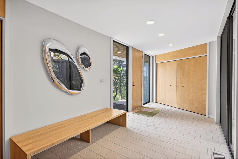 The entry foyer offers a spacious coat closet.