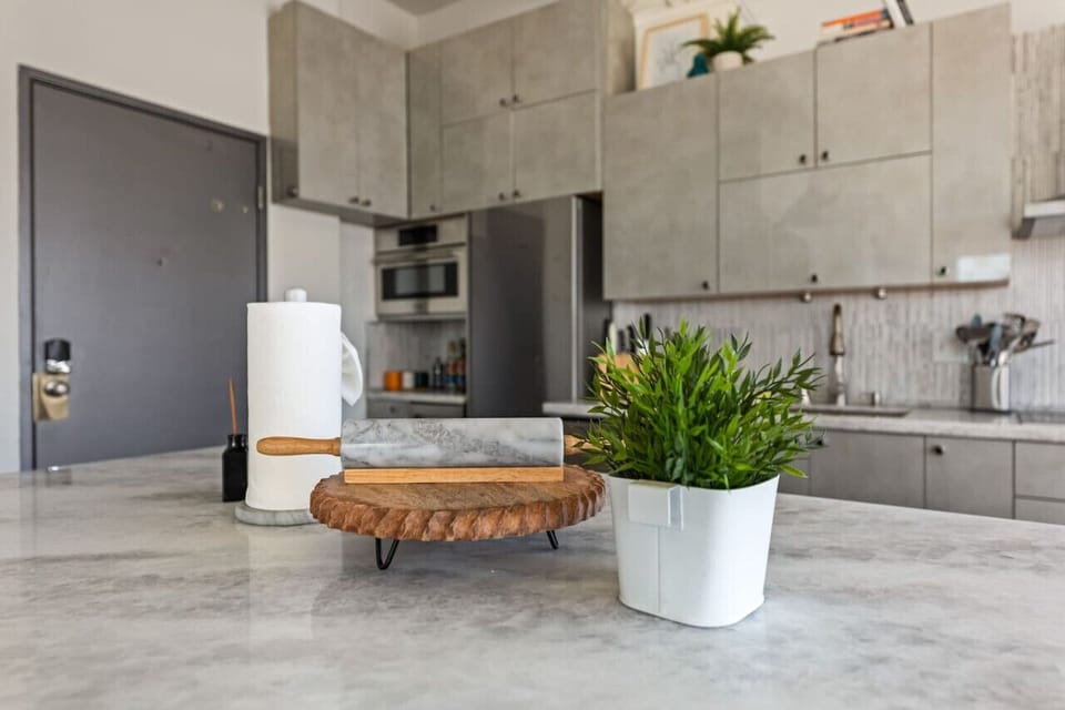 Detailed view of the kitchen island, perfect for meal prep or enjoying a quick snack. Modern and inviting design.