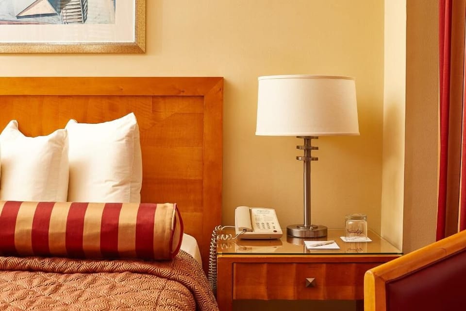 Drift off with bedside lighting and everything within reach.