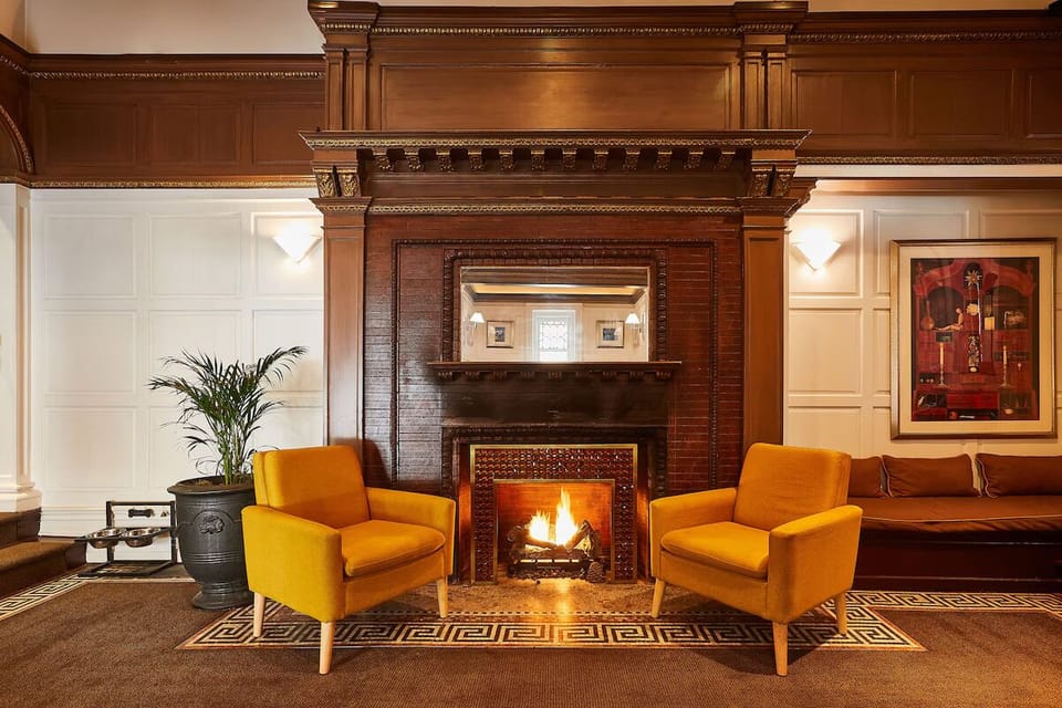 Unwind by the glowing fireplace in a cozy, elegant lounge.