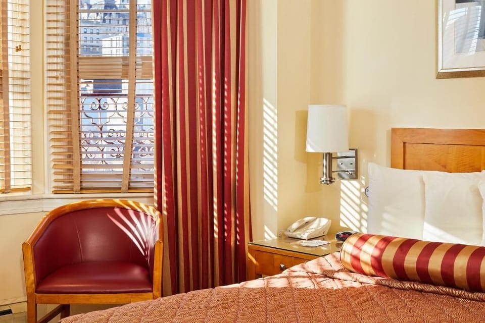 Wake gently with golden window light and bedside comforts.