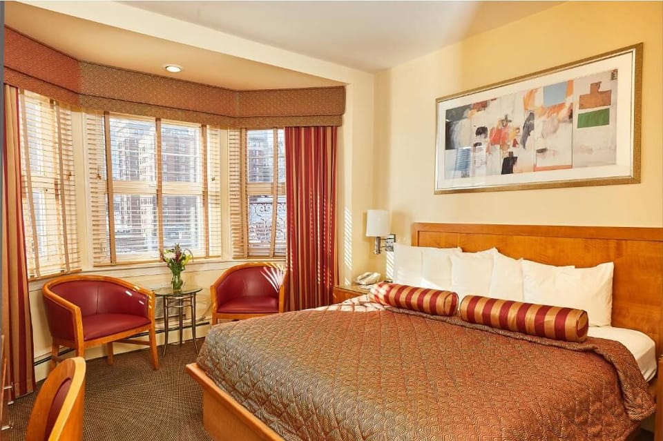 Stretch out on crisp linens beside warm light and soft textures.