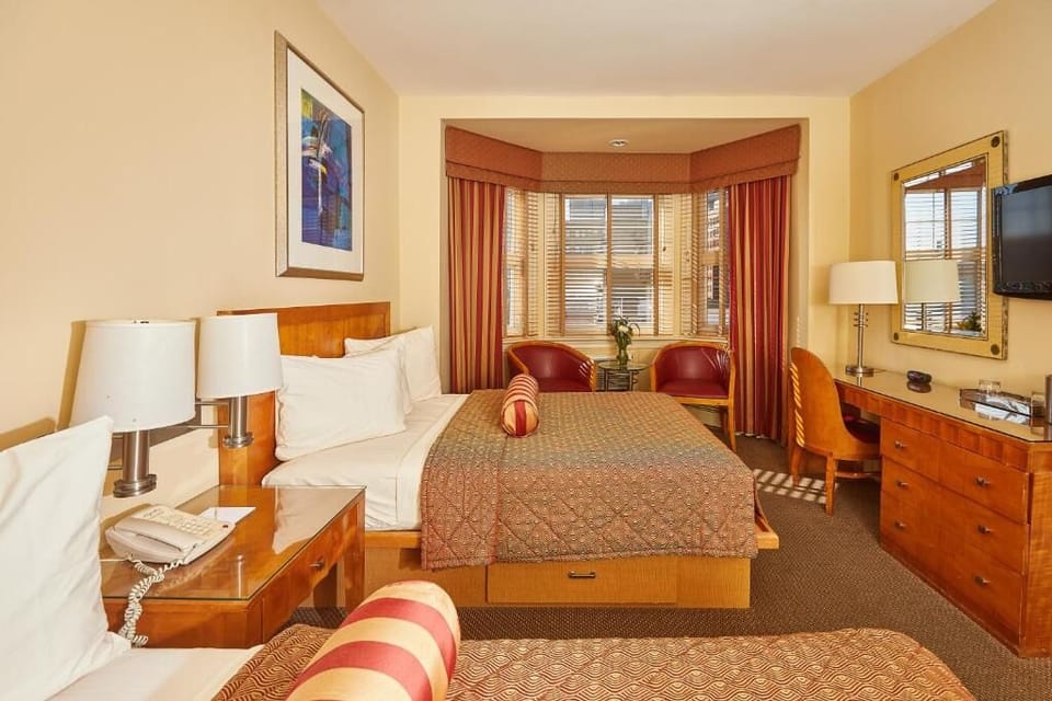 Unwind in a bright bay-window room with cozy seating nook.