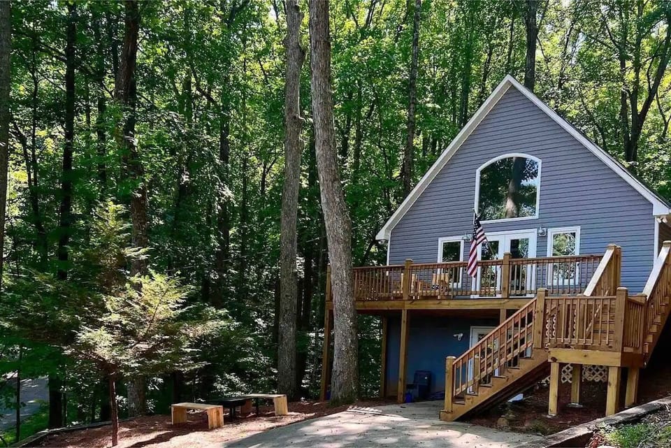 Front view in spring/summer with private driveway