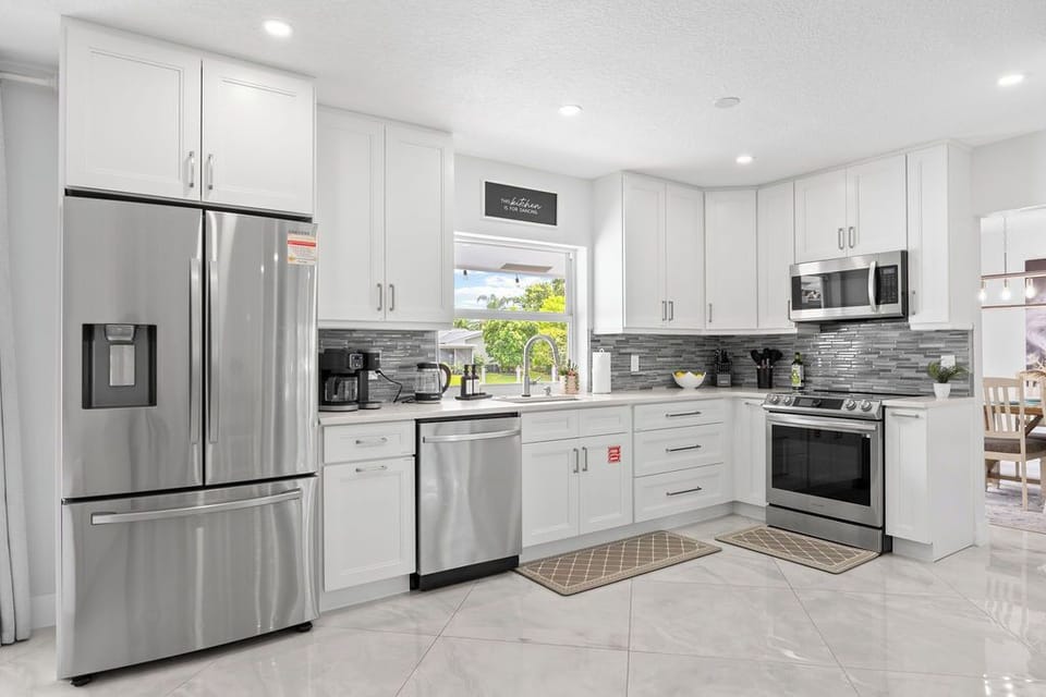 Gourmet Kitchen: Cook up a storm in this sleek kitchen with stainless appliances and chic decor!