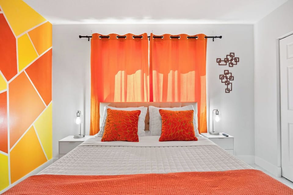 Vibrant Bedroom: Bright hues and unique decor create an energizing retreat for restful nights.